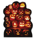 A group of glowing orange jack-o'-lanterns stacked in rows, each carved with a different expressive face, lit from within against a dark background.
