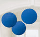 Three round royal blue paper lanterns with ribbed texture, hanging from thin strings against a light blue background.