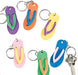 Six flip-flop keychains in assorted colors: purple with green straps, orange with blue straps, yellow with purple straps, pink with yellow straps, green with orange straps, and blue with pink straps, each attached to a metal keyring.