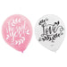 One pink balloon with the words ‘she said yes!’ in white script surrounded by leafy accents, next to a white balloon with the word ‘Love’ in black script with leafy decorations.