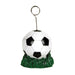 Soccer-themed card or balloon holder featuring a black and white soccer ball resting on a green grass-like base, with a metal wire holder extending upward and ending in a circular clip.