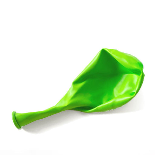 Single uninflated lime green balloon lying flat on a white background.