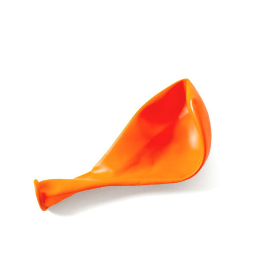 Deflated orange latex balloon with a smooth, slightly crumpled surface, lying flat on a white background.