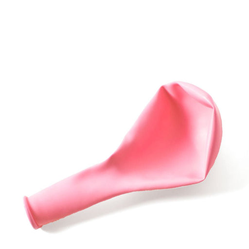 Uninflated light pink balloon lying on a white surface.