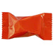 Individually wrapped candy in a shiny red metallic wrapper with crimped edges, displayed against a white background.