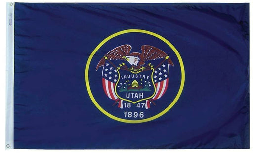 A dark blue flag with the Utah state seal in the center, featuring a bald eagle above a beehive labeled 'INDUSTRY,' flanked by U.S. flags, the word 'UTAH,' and the dates '1847' and '1896'.