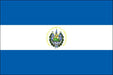 Rectangular flag with three horizontal stripes: blue on the top and bottom, and white in the center. A detailed national emblem is centered within the white stripe, containing a triangle, flags, and a laurel wreath.