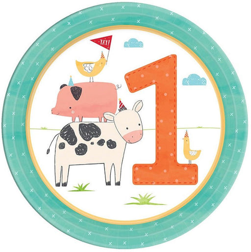 Round paper plate with a farm-themed first birthday design. The illustration shows a cow, pig, and chickens wearing party hats next to a large orange number '1' with a teal border around the plate.