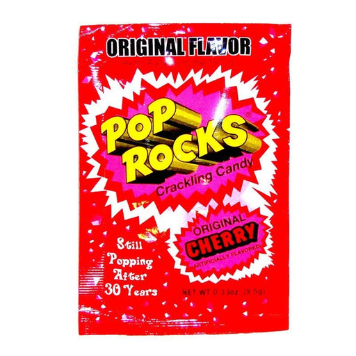 A bright red packet of Pop Rocks Original Cherry Crackling Candy. The packaging features bold yellow and pink comic-style bursts with 'Pop Rocks' written in large yellow letters. Below, it says 'Crackling Candy' and 'Original Cherry Artificially Flavored.' Additional text reads 'Still Popping After 30 Years' in white lettering. Net weight is 0.33 oz (9.5g).