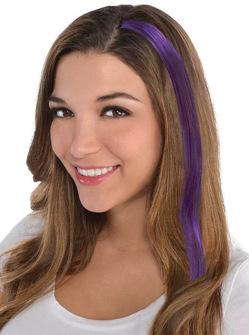 Model wearing a long, straight purple hair extension clipped into brown hair – vibrant synthetic strand adds a bold pop of color, perfect for parties, costumes, spirit days, or fun fashion accents.