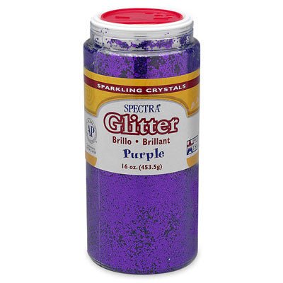 Container of Spectra Sparkling Crystals glitter in purple, 4 oz (113.3 g), with a red flip-top lid. The label features the Spectra brand name prominently in red glittery font, includes the word 'Glitter' with translations 'Brillo' and 'Brillant', and indicates the color as 'Purple'. It displays an AP seal for non-toxicity, a Made in USA emblem, and a bilingual layout in English, Spanish, and French.
