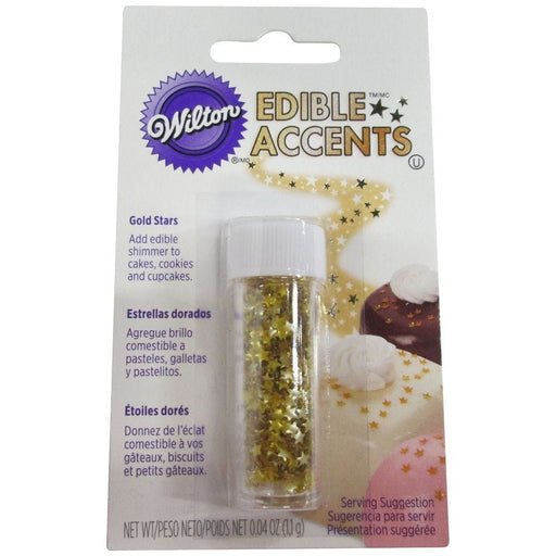 Wilton Edible Accents Gold Stars in a clear plastic jar with a white screw-on lid, packaged on a white and purple backing card with product information and images of decorated desserts.