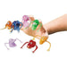 Stretchy monster finger puppets in assorted colors—orange, blue, pink, green, purple, red, and yellow—each with bulging eyes and extended arms, worn on fingers of a hand for playful display.