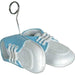 Baby blue shoe balloon weight featuring a pair of white shoes with baby blue accents and detailed stitching. A metal loop holder extends upward from one of the shoes, designed to securely hold balloons in place for baby showers or celebrations.