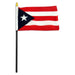 Rectangular flag with five alternating red and white horizontal stripes. A blue triangle on the hoist side contains a single white five-pointed star. The flag is mounted on a black pole with a white sleeve and a gold spear-shaped tip.