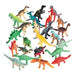 Assortment of colorful plastic dinosaur figurines in a variety of species and poses, featuring a mix of red, green, yellow, orange, blue, black, brown, gray, and beige tones. Some dinosaurs are single-colored while others have gradient or two-toned patterns. Species include Triceratops, Stegosaurus, Tyrannosaurus rex, Brachiosaurus, and more.