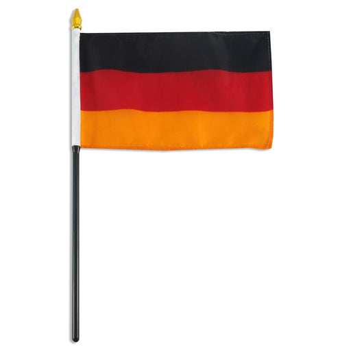 Rectangular flag with three horizontal stripes in black on top, red in the middle, and gold at the bottom. The flag is attached to a black pole with a white sleeve and a gold spear-shaped tip.