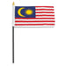 Rectangular flag with alternating red and white horizontal stripes. In the top left corner, there is a blue rectangle containing a yellow crescent moon and a yellow 14-pointed star. The flag is attached to a black pole with a white sleeve and a gold spear-shaped tip.