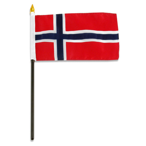 Rectangular flag with a red background and a blue cross outlined in white. The cross extends to all edges and is shifted toward the left side. The flag is mounted on a black pole with a white sleeve and a gold spear-shaped tip.